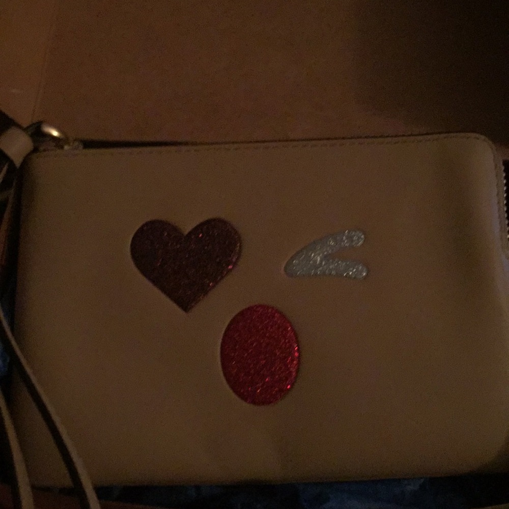 Adorable Rudolph themed emoji Coach wristlet!